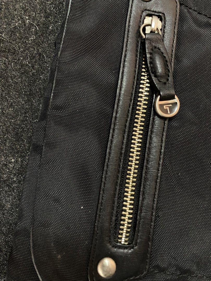 TUMI Crossbody Black Bags (Category: Sling Bags) located in Quezon City. Submitted by loloyz123 (Listing ID 1457915074, Image 2). Description: TUMI Crossbody Black Bags Condition: Very good Color rate: 10/10 Color: Black Size: L: 12 w: 11 inches.