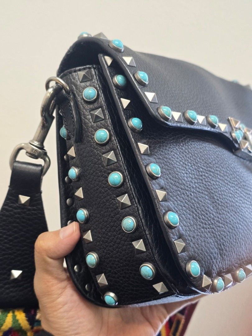 Valentino Black Rolling Rockstud Crossbody Bag (Category: Luxury Bags & Wallets) located in Taguig. Submitted by mluxeph (Listing ID 1457932658, Image 3). Description: Valentino Black Rolling Rockstud Crossbody Bag Material: Pebble leather Stamp: CB-K053VH72 Interior: Three main compartments and one zip pocket Measurements: 10.25”L X 3”W X 7.6”H Handle Drop: 22.5" adjustable Hardware: Silver tone Inclusions: Original dust bag, care card and extra