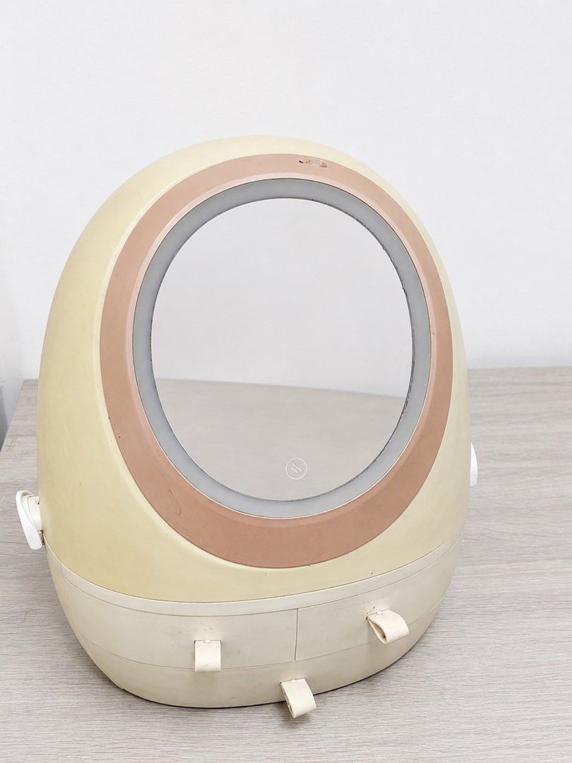 Vanity Makeup Organizer with Lighted Mirror and Drawers (Category: Makeup) located in Quezon City. Submitted by boldcat_343a70 (Listing ID 1458065054, Image 1). Description: - Cute egg-shaped makeup organizer - Built-in lighted mirror on top (flips open) - Spacious interior for lipsticks and cosmetics - Two bottom drawers for additional storage - Perfect for a tidy vanity - Light is fully functional Selling my preloved LED vanity mirror with a bu