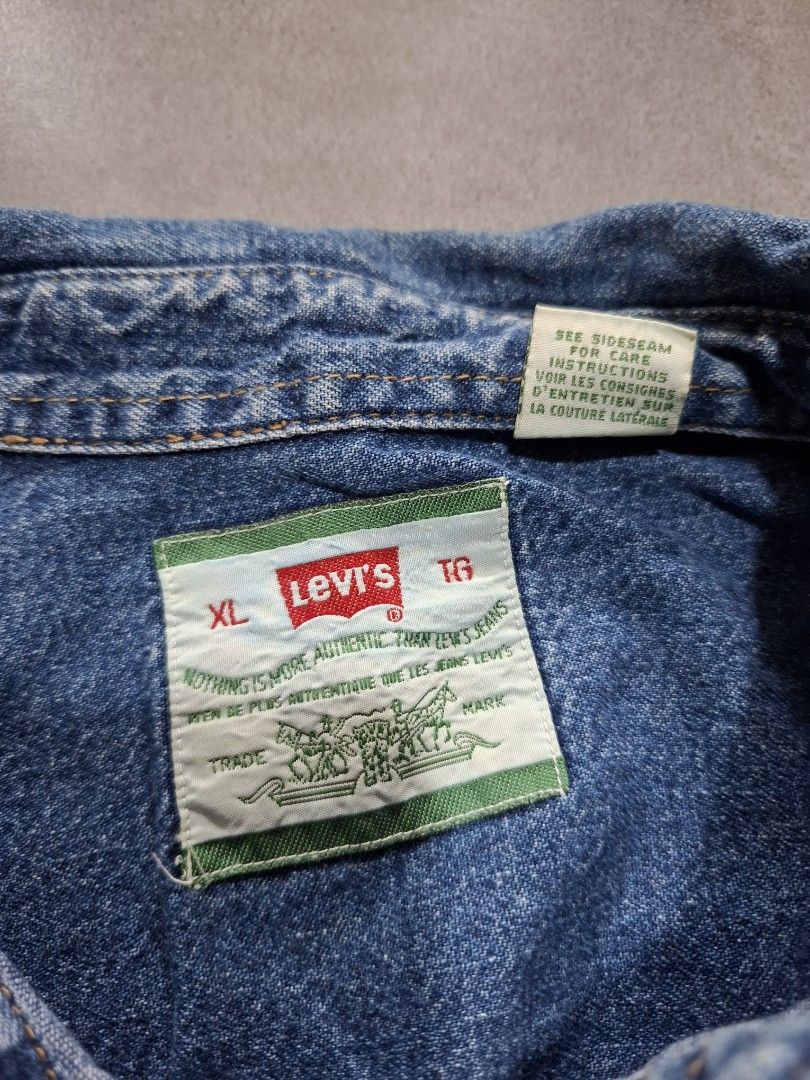 Vintage 90's Levi's Men's Denim Button-up (Category: Activewear) located in Rizal. Submitted by marcothrifts (Listing ID 1458024433, Image 2). Description: Vintage 90's Levi's Men's Denim Button-up metal button's XL on tag Width: 25 Length: 30 Color rate: 9.9/10 Dead stock Condition.