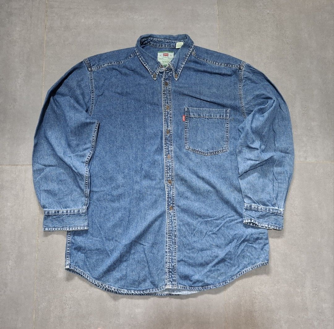 Vintage 90's Levi's Men's Denim Button-up (Category: Activewear) located in Rizal. Submitted by marcothrifts (Listing ID 1458024433, Image 1). Description: Vintage 90's Levi's Men's Denim Button-up metal button's XL on tag Width: 25 Length: 30 Color rate: 9.9/10 Dead stock Condition.