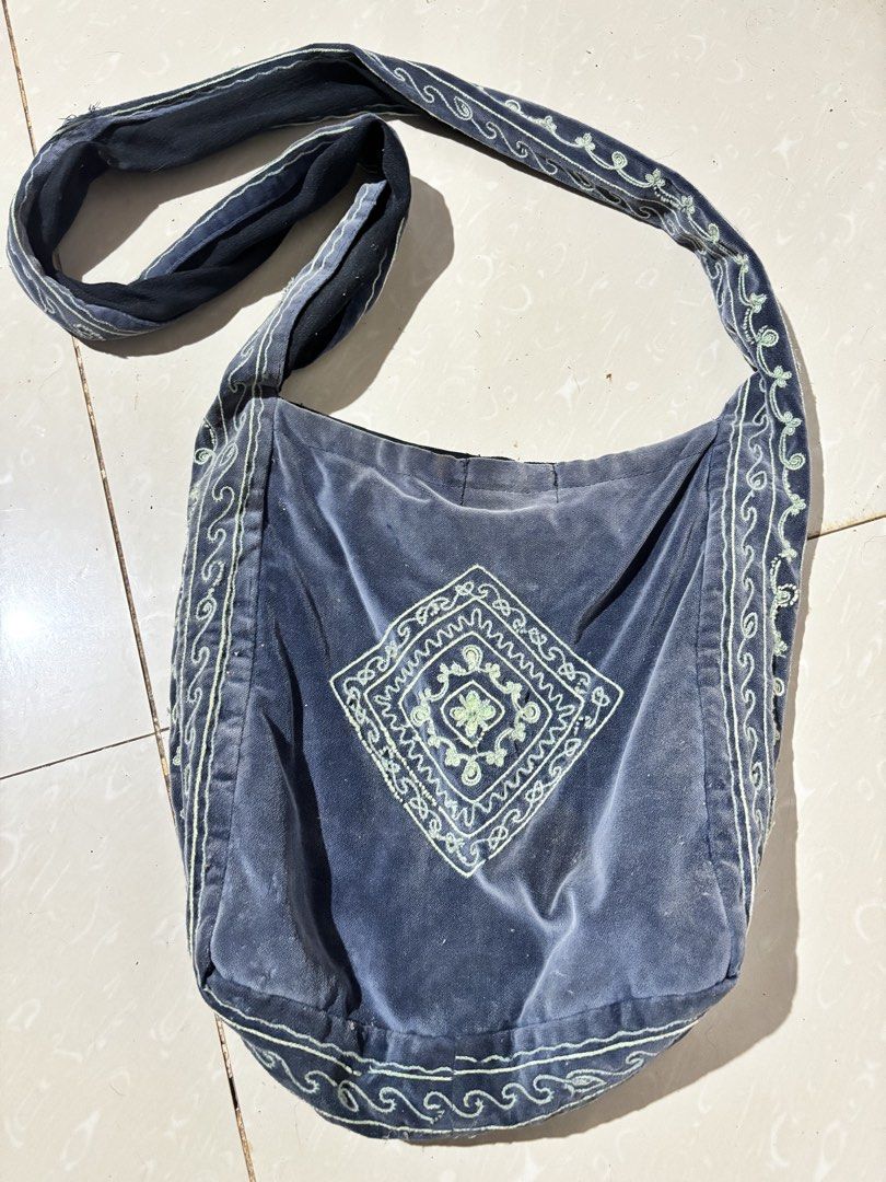Vintage Boho Embroidered Velvet Shoulder Bag Grey Blue Crossbody Hobo Tote (Category: Cross-body Bags) located in Zamboanga. Submitted by ncollects (Listing ID 1444645269, Image 1). Description: Add a touch of effortless boho charm to your outfit with this vintage-style slouchy crossbody bag. Crafted from a soft, grey-blue velvet fabric, it features unique sage green geometric embroidery on the front panel and along the wide, comfortable shoulder