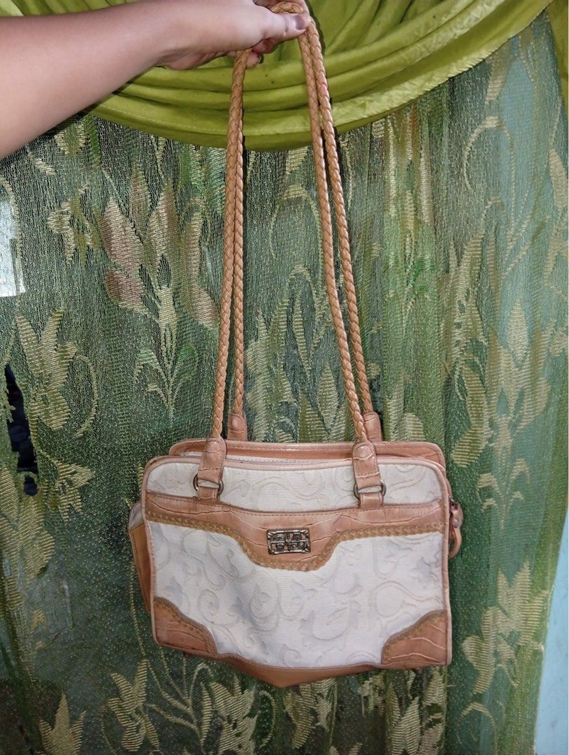 Vintage casual shoulder bag (Category: Luxury Bags & Wallets) located in Abucay. Submitted by thriftshop__by__liezel (Listing ID 1458011941, Image 2). Description: shoulder tote bag / casual everyday bag with a vintage-inspired design 😊 Bag Details from the photo: - Style: Medium shoulder tote / handbag - Material: Jacquard/embossed fabric body + faux leather/PU trim in nude/tan - Details: - Braided rope handles - Metal logo plaque in the center