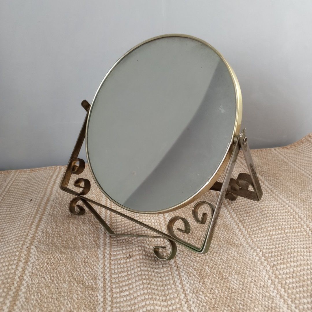 Vintage Double Sided Metal Swivel Table Mirror (Category: Tables & Sets) located in Legazpi City. Submitted by Love_Maya (Listing ID 1458003691, Image 2). Description: - Oval tabletop mirror with decorative metal stand - Stand features intricate scrollwork details - Swivels for easy angle adjustment - Ideal for vanities, dressers, or any space needing vintage charm .
