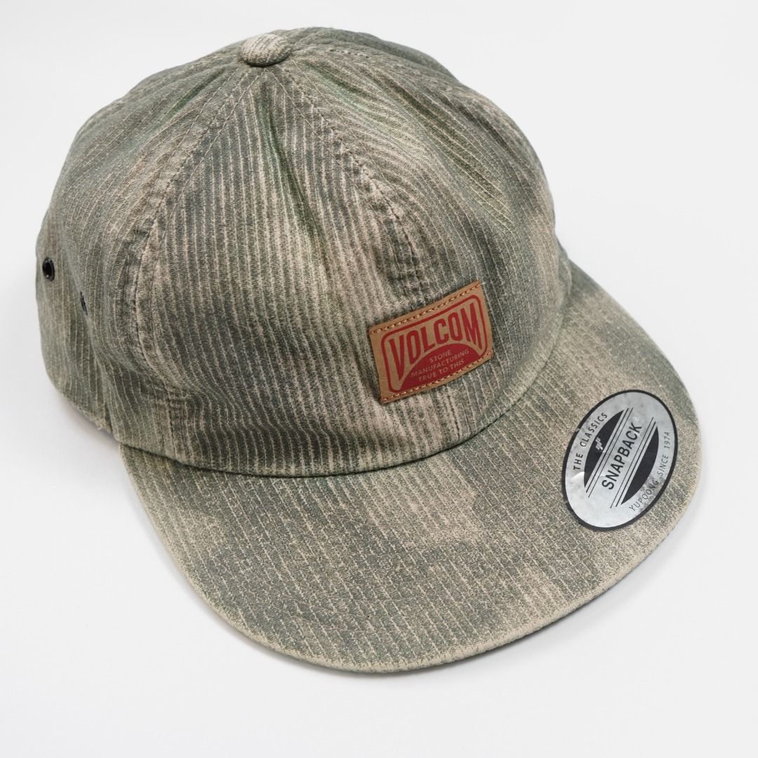 Volcom Snapback Cap - The Classics Yupoong (Category: Caps & Hats) located in Caloocan City. Submitted by jiggyj01 (Listing ID 1458039854, Image 1). Description: - Classic Volcom logo patch on front - Unique faded green and beige corduroy-like texture - Adjustable Yupoong Classics snapback closure - One size fits most.