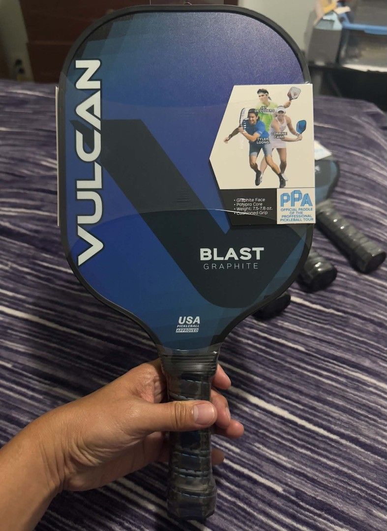VULCAN Blast Graphite Pickleball Paddle (Category: Racket and Ball Sports) located in Valenzuela. Submitted by blakeys_atbp (Listing ID 1457947841, Image 1). Description: - VULCAN Blast Graphite Pickleball Paddle - Ideal for all-court players - Delivers power, control, and spin - Balanced feel with a comfortable cushioned grip - Graphite face and 9mm polymer core - Lightweight: 7.5-7.8 oz - USA Pickleball approved.