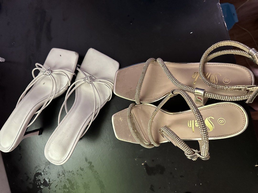 White & Gold Embellished Sandals (Category: Flats & Sandals) located in Manila. Submitted by _cchampagnegyal (Listing ID 1457947987, Image 1). Description: - Two pairs of stylish sandals, both size 8. - White pair features a charming bow and rhinestone detail. - Gold pair boasts elegant rhinestone straps and an ankle buckle. - Versatile: dress them up or wear them casually. no issue needs clean for aspack only 📍 North Caloocan.