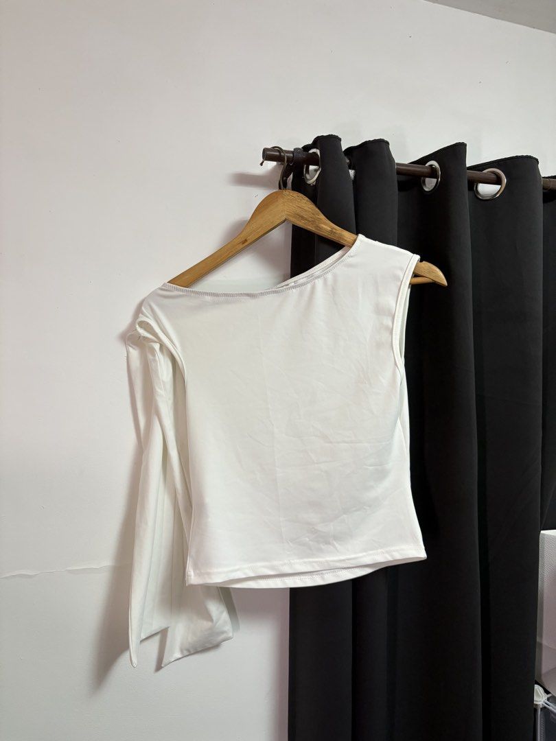 White Asymmetrical Long Sleeve Crop Top (Category: Longsleeves) located in Manila. Submitted by jeweeeel (Listing ID 1458030236, Image 1). Description: - Trendy white crop top - Unique asymmetrical design: one long sleeve, one sleeveless - Flattering asymmetrical neckline - Comfortable stretchy material - Versatile: great for layering or wearing solo - Simple, chic, and fits well.