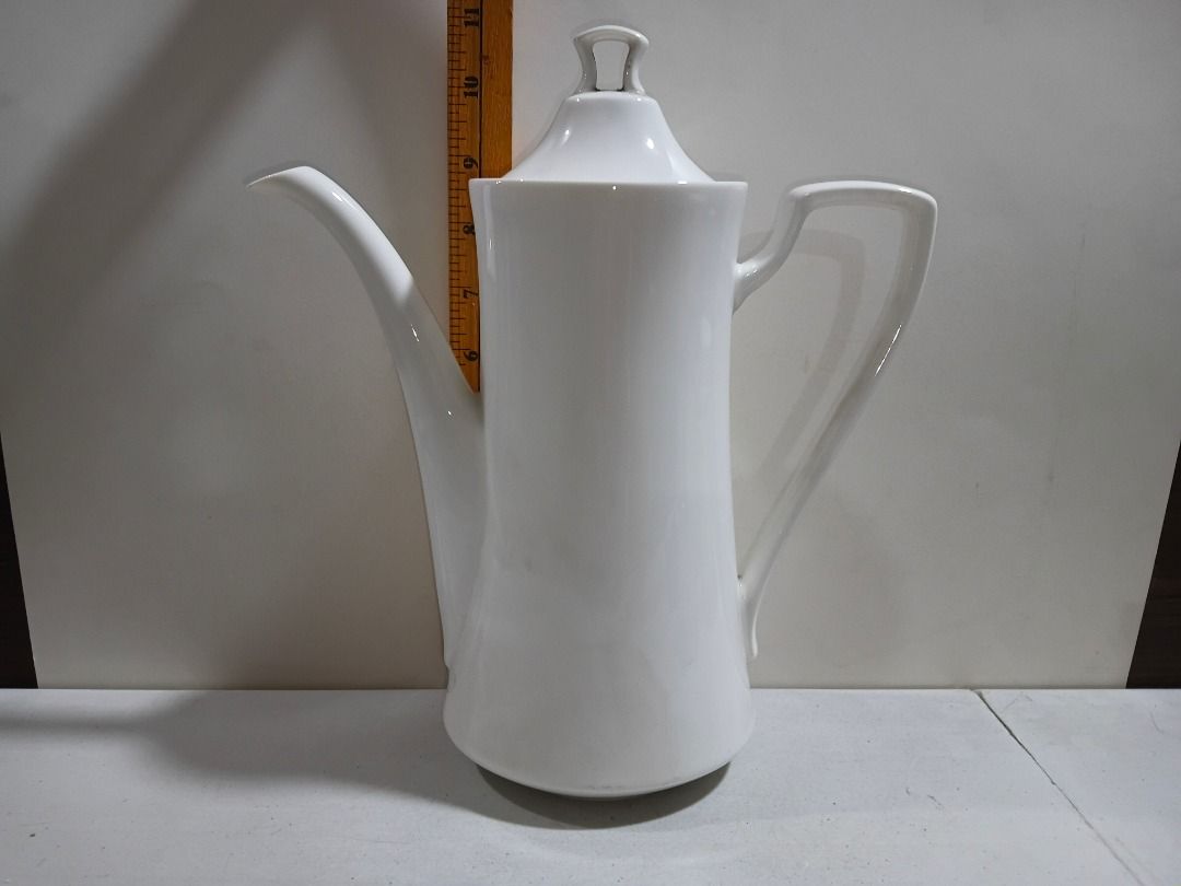 White Ceramic Coffee Pot with Lid (Sleek Minimalist) (Category: Coffee & Tea Tableware) located in Marikina City. Submitted by my-an (Listing ID 1458039748, Image 1). Description: White Ceramic Coffee Pot with Lid (Sleek Minimalist) - Tall white ceramic coffee pot with matching lid. - Features a long spout and a comfortable curved handle. - Ideal for serving hot beverages like coffee or tea. - Simple, classic design complements any kitchen or din