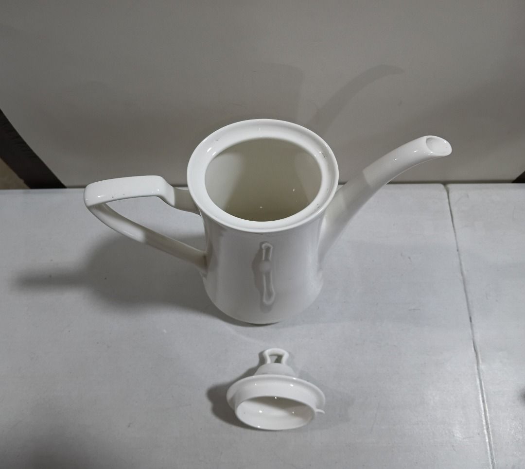 White Ceramic Coffee Pot with Lid (Sleek Minimalist) (Category: Coffee & Tea Tableware) located in Marikina City. Submitted by my-an (Listing ID 1458039748, Image 3). Description: White Ceramic Coffee Pot with Lid (Sleek Minimalist) - Tall white ceramic coffee pot with matching lid. - Features a long spout and a comfortable curved handle. - Ideal for serving hot beverages like coffee or tea. - Simple, classic design complements any kitchen or din