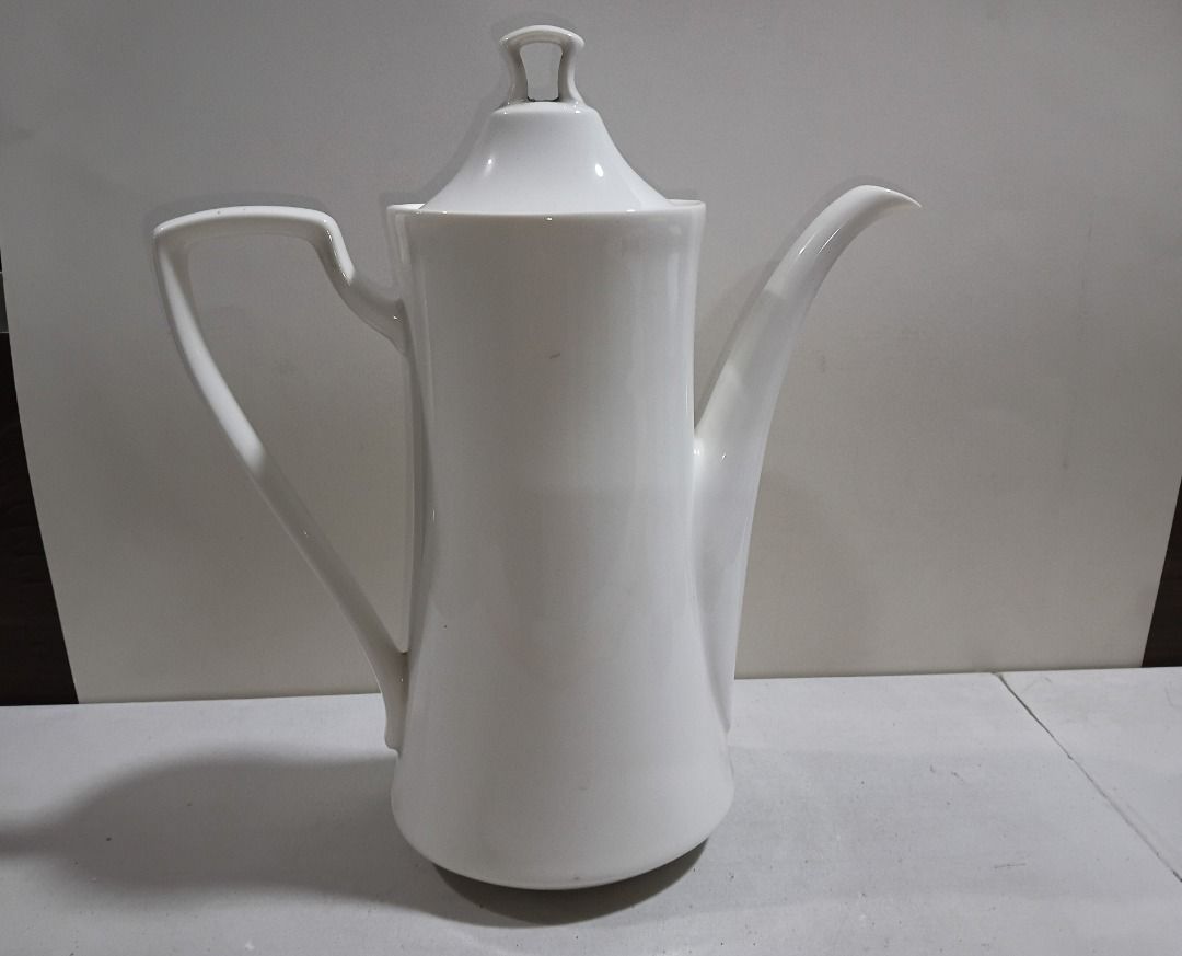 White Ceramic Coffee Pot with Lid (Sleek Minimalist) (Category: Coffee & Tea Tableware) located in Marikina City. Submitted by my-an (Listing ID 1458039748, Image 2). Description: White Ceramic Coffee Pot with Lid (Sleek Minimalist) - Tall white ceramic coffee pot with matching lid. - Features a long spout and a comfortable curved handle. - Ideal for serving hot beverages like coffee or tea. - Simple, classic design complements any kitchen or din