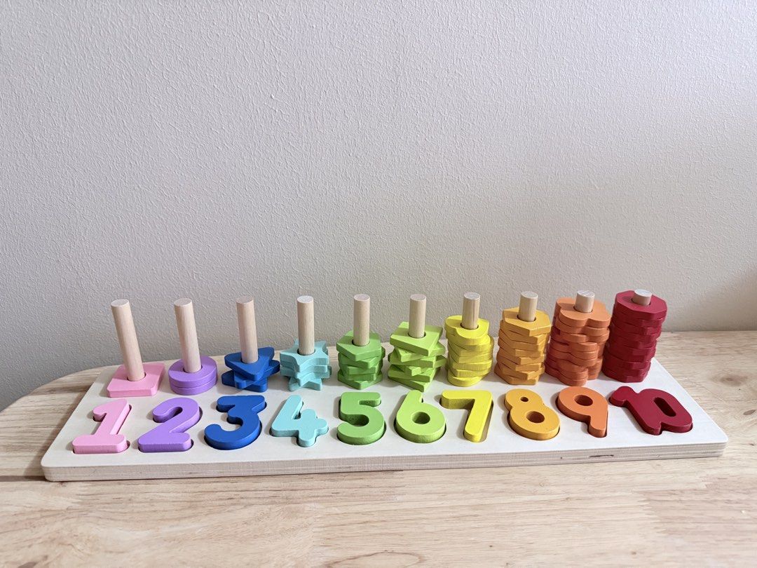 Wooden Number Stacking Toy (Category: Educational & Learning Toys) located in San Juan City. Submitted by nadine.chavez (Listing ID 1457973343, Image 1). Description: - Wooden toy with numbers 1-10. - Each number has wooden shapes for stacking. - Includes colorful stacking shapes. - Excellent for learning numbers and colors. - Develops fine motor skills. - Made from durable wood..
