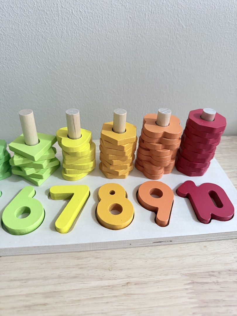 Wooden Number Stacking Toy (Category: Educational & Learning Toys) located in San Juan City. Submitted by nadine.chavez (Listing ID 1457973343, Image 3). Description: - Wooden toy with numbers 1-10. - Each number has wooden shapes for stacking. - Includes colorful stacking shapes. - Excellent for learning numbers and colors. - Develops fine motor skills. - Made from durable wood..