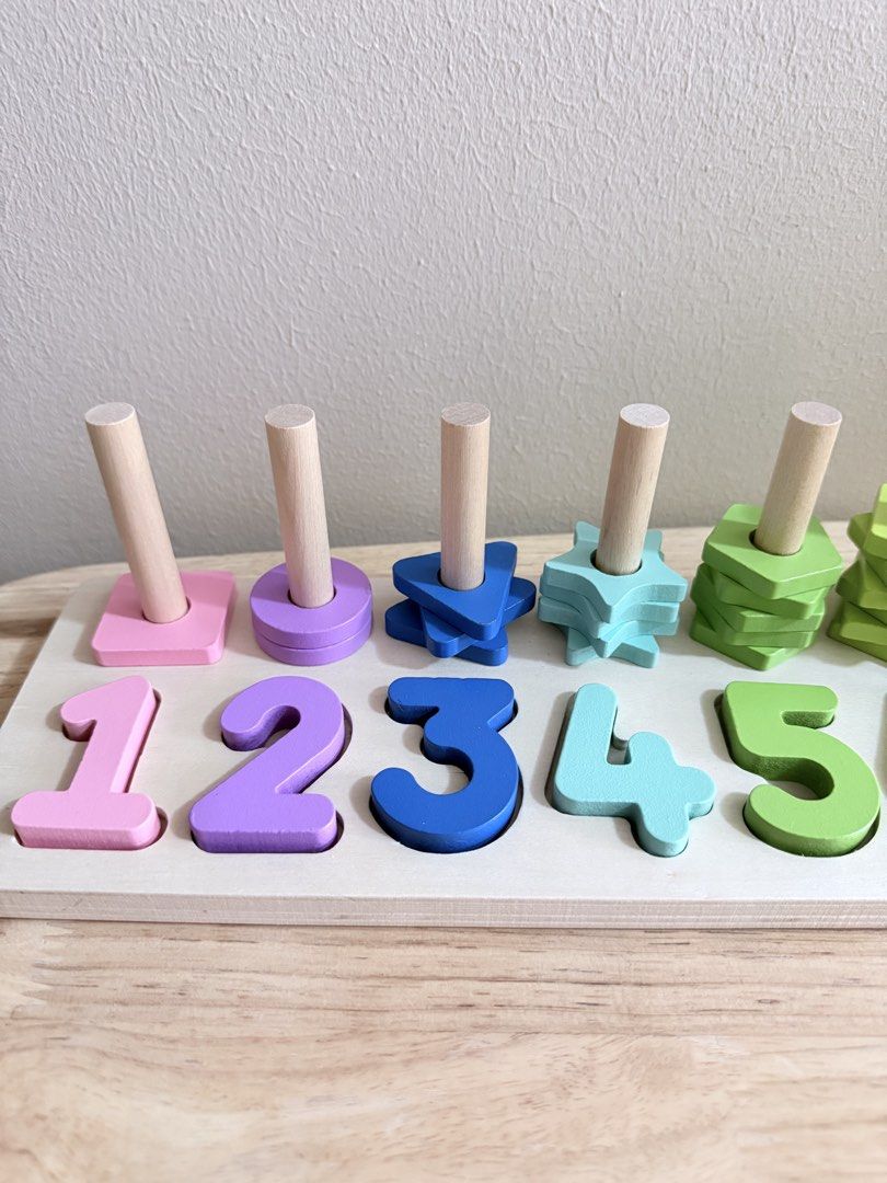 Wooden Number Stacking Toy (Category: Educational & Learning Toys) located in San Juan City. Submitted by nadine.chavez (Listing ID 1457973343, Image 2). Description: - Wooden toy with numbers 1-10. - Each number has wooden shapes for stacking. - Includes colorful stacking shapes. - Excellent for learning numbers and colors. - Develops fine motor skills. - Made from durable wood..