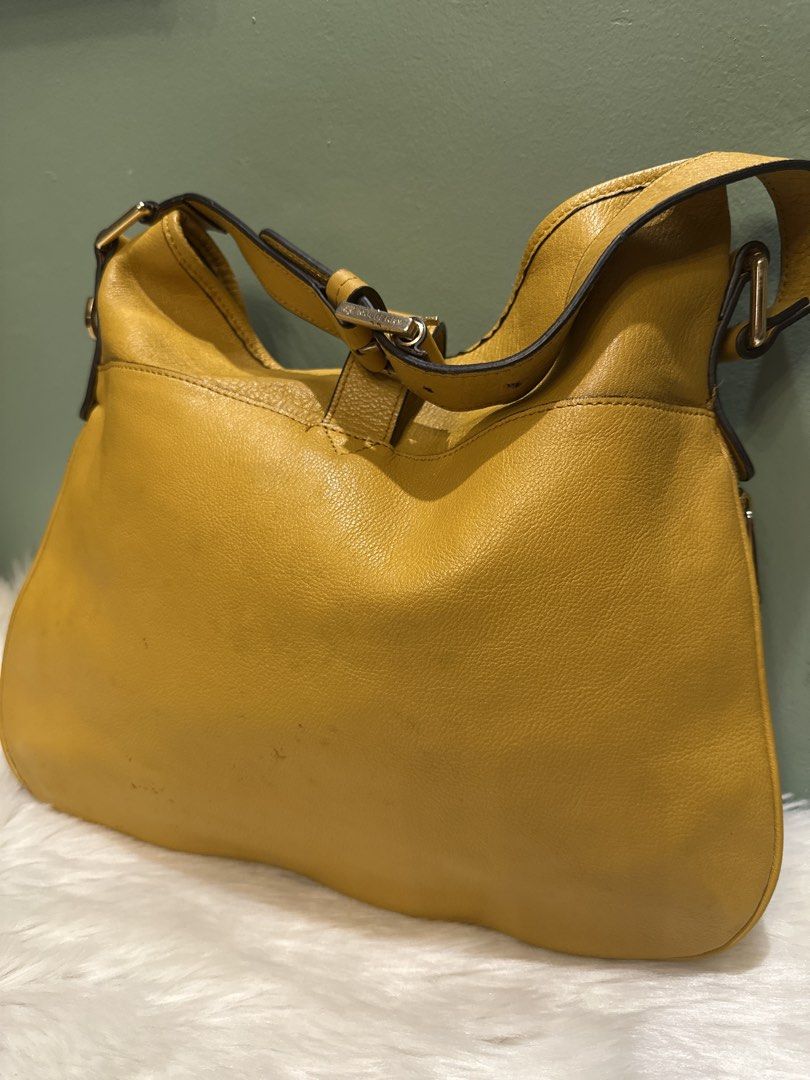 Yellow Leather Hobo Shoulder Bag (Category: Shoulder Bags) located in Paranaque City. Submitted by love1927 (Listing ID 1457951672, Image 2). Description: - up for grabs is my limited edition Authentic Mulberry bag made in England personally bought it at the boutique letting go of my mulberry collection - Multiple zippered pockets on the front for organization - Decorative buckle details on the straps - Elegant gold hardware - Ample interior spac