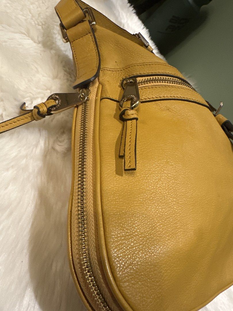 Yellow Leather Hobo Shoulder Bag (Category: Shoulder Bags) located in Paranaque City. Submitted by love1927 (Listing ID 1457951672, Image 3). Description: - up for grabs is my limited edition Authentic Mulberry bag made in England personally bought it at the boutique letting go of my mulberry collection - Multiple zippered pockets on the front for organization - Decorative buckle details on the straps - Elegant gold hardware - Ample interior spac