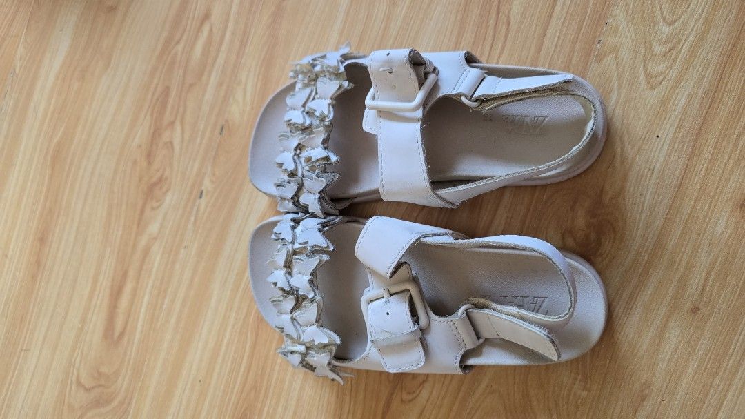 Zara White Butterfly Sandals Size 28 (Category: Flats & Sandals) located in Quezon City. Submitted by impdc1130 (Listing ID 1458081218, Image 2). Description: - Adorable white sandals from Zara - Features a charming butterfly detail on the front strap - Secure buckle closure for easy wear - Perfect for kids - Size 28.