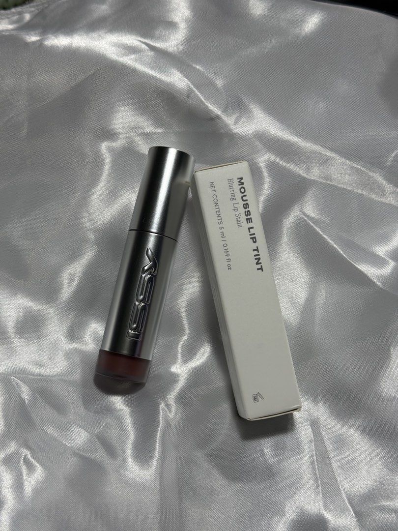 3CE MOUSSE LIP TINT - FIXATION (Category: Makeup) located in Plaridel. Submitted by santosroce65316 (Listing ID 1458276447, Image 1). Description: - 3CE Mousse Lip Tint in shade Fixation - Blurring lip satin formula - Sleek, silver packaging - Shade: Muted rosy brown (great for natural/soft looks) - Includes original box.