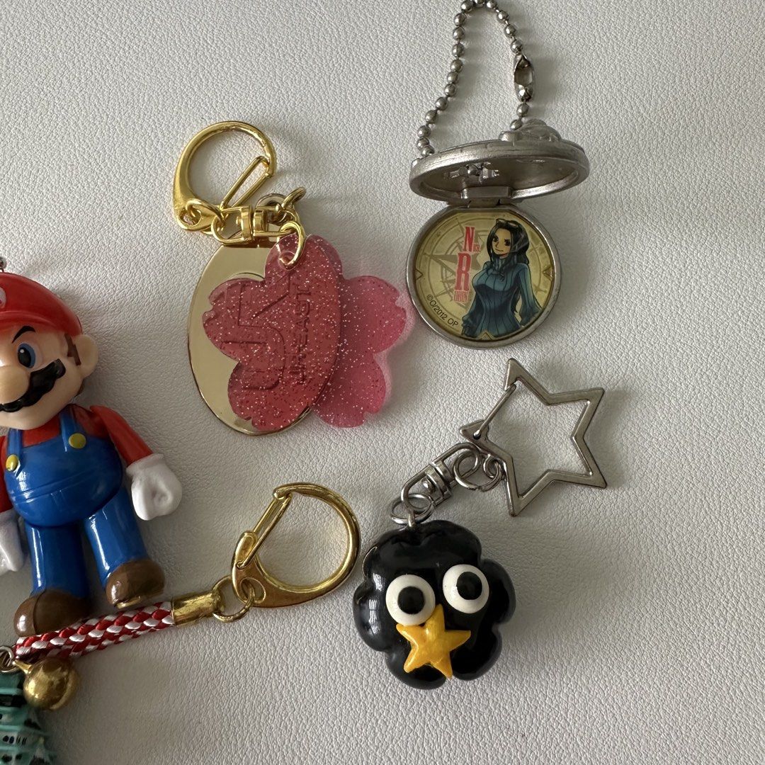 𖦹 Assorted Keychains ($2 - $3) (Category: J-Wave Merchandise) located in Singapore. Submitted by mewcury_ (Listing ID 1458148261, Image 3). Description: 𖦹 Ghibli Catbus - $2 𖦹 Grey Cat Gacha - $3 𖦹 Mario - $3 𖦹 Sakura JR - $2 𖦹 Osaka Castle - $2 𖦹 Handmade Ghibli Soot - $3 𖦹 One Piece Robin Locket - $3 ✦•┈๑⋅⋯ ⋯⋅๑┈·✦ 𖦹 Available 𖦹 Not Open To Trade 𖦹 Meet: Woodleigh, Others +$ 𖦹 Postage: +$2 Tracked 𖦹 Payment: Cash, Paynow, Paylah.