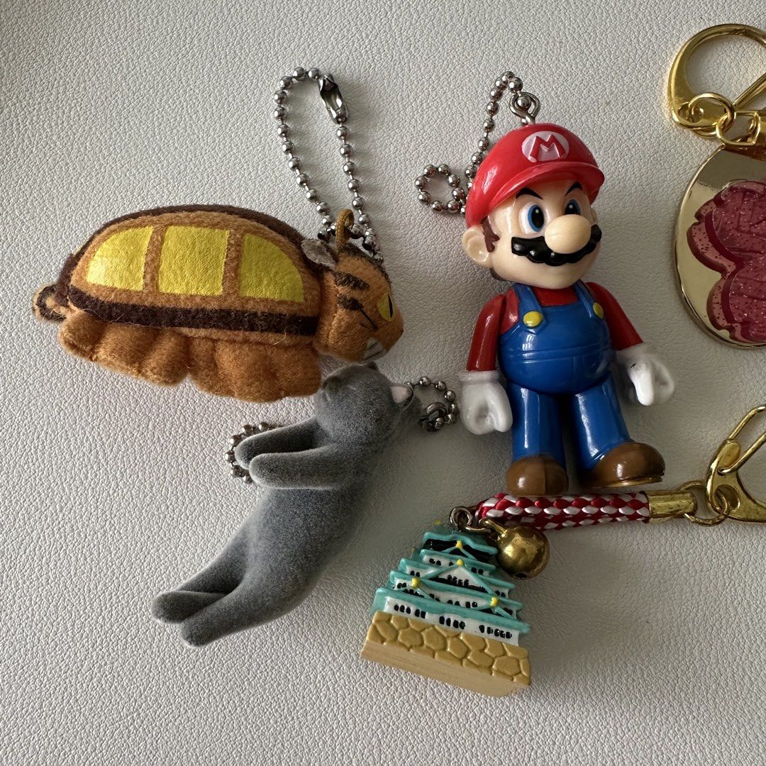 𖦹 Assorted Keychains ($2 - $3) (Category: J-Wave Merchandise) located in Singapore. Submitted by mewcury_ (Listing ID 1458148261, Image 2). Description: 𖦹 Ghibli Catbus - $2 𖦹 Grey Cat Gacha - $3 𖦹 Mario - $3 𖦹 Sakura JR - $2 𖦹 Osaka Castle - $2 𖦹 Handmade Ghibli Soot - $3 𖦹 One Piece Robin Locket - $3 ✦•┈๑⋅⋯ ⋯⋅๑┈·✦ 𖦹 Available 𖦹 Not Open To Trade 𖦹 Meet: Woodleigh, Others +$ 𖦹 Postage: +$2 Tracked 𖦹 Payment: Cash, Paynow, Paylah.