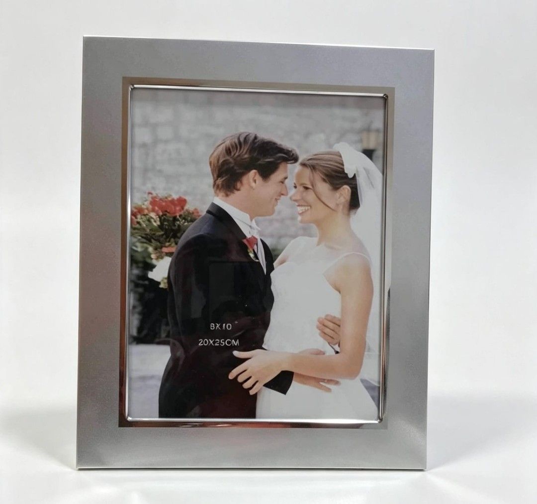 🖼️ Silver-Tone Photo Frame (Category: Frames & Pictures) located in Paranaque City. Submitted by gentle.declutter (Listing ID 1458124384, Image 1). Description: Size: Fits 8" × 10" (20 × 25 cm) photos Finish: Smooth polished silver-tone with sleek modern border Condition: ✅ Unused / brand new — has a minor small dent from storage, never displayed Clean, elegant design — great for portraits, wedding photos, or any special keepsake. Sturdy and cla