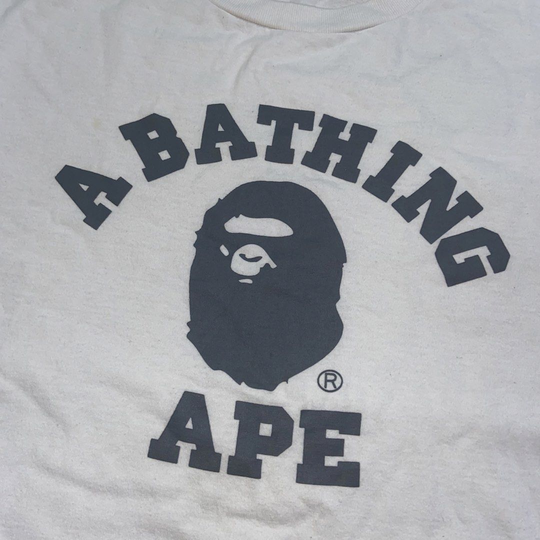 A Bathing Ape College Tee (Category: Formal Shirts) located in Dasmarinas. Submitted by thrift2gems (Listing ID 1458198099, Image 2). Description: A Bathing Ape College Tee✨ -WIDTH: 21.5 -LENGTH: 27 -COLOR RATE: 9.5/10 -CONDITION: 9.5/10 -ISSUE: NEED WASH.
