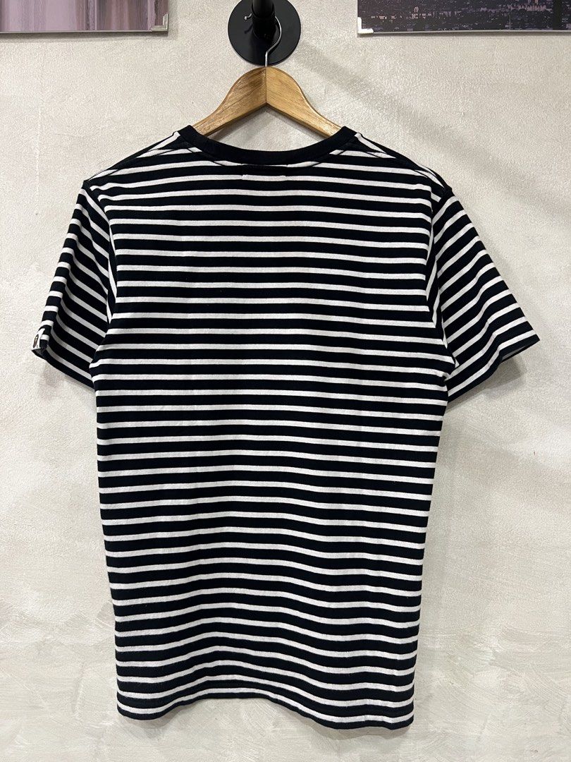 A Bathing Ape Mens College Hoop tee (Category: Tshirts & Polo Shirts ) located in Manila. Submitted by -handpick- (Listing ID 1458255720, Image 2). Description: This is the black-and-white striped A Bathing Ape (BAPE) College Hoop Tee featuring the signature arched logo and Ape Head graphic on the front. Size : Medium Dimensions: Length : 27 inches Width : 19 inches Shoulder : 18 inches Sleeve: 8 inches Sign of wear in good condition .