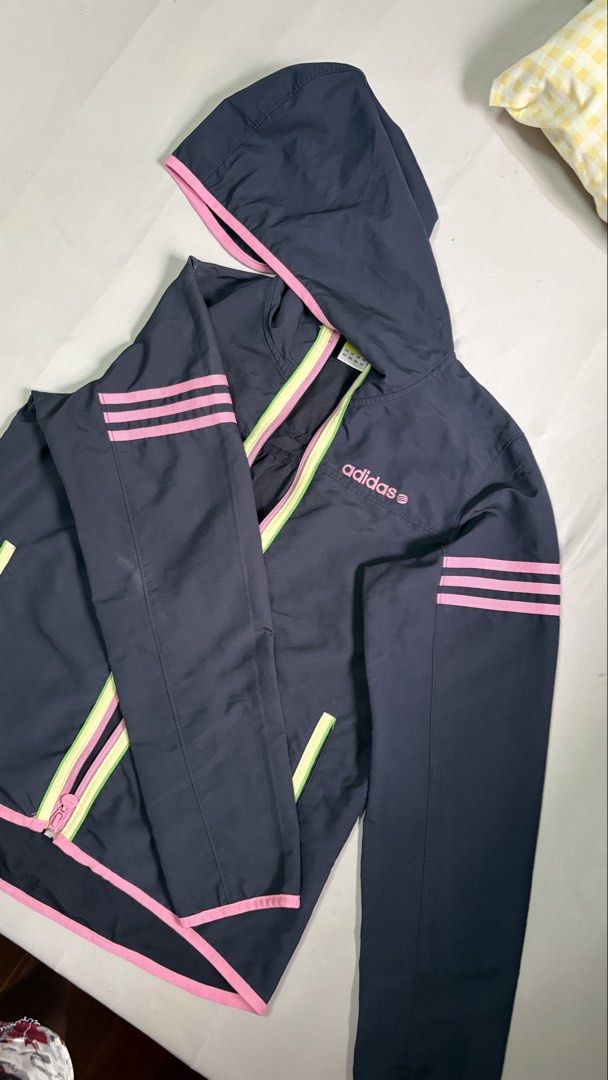Adidas Neo Label Hooded Jacket (Category: Coats, Jackets and Outerwear) located in Cavite. Submitted by cariaqui0422 (Listing ID 1458136177, Image 1). Description: - Dark grey Adidas Neo jacket - Size: Large (L) - Hooded design - Zip-up front - Pink and lime green accents - Classic Adidas three stripes on sleeves - Ideal for casual wear or light workouts.