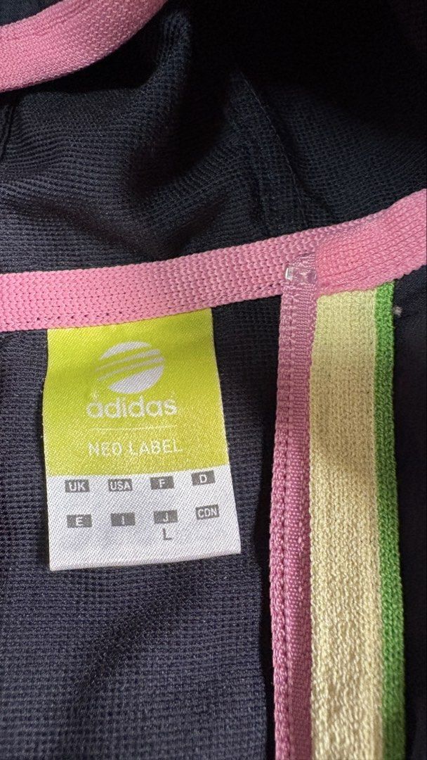 Adidas Neo Label Hooded Jacket (Category: Coats, Jackets and Outerwear) located in Cavite. Submitted by cariaqui0422 (Listing ID 1458136177, Image 3). Description: - Dark grey Adidas Neo jacket - Size: Large (L) - Hooded design - Zip-up front - Pink and lime green accents - Classic Adidas three stripes on sleeves - Ideal for casual wear or light workouts.