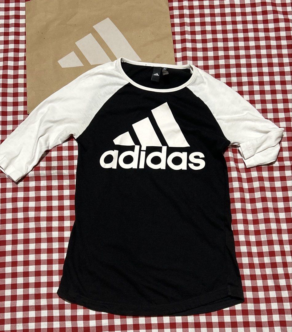 Adidas Raglan Tee Black White Logo 3-Stripes (Category: Shirts) located in Manila. Submitted by ilovebubu28 (Listing ID 1458154915, Image 3). Description: - Adidas raglan t-shirt - Black body with white 3-stripes logo on front - White 3/4 sleeves - Classic sporty design - Perfect for casual wear or workouts - Easily pairs with jeans or shorts Made in Pakistan Color rate 10/10 .