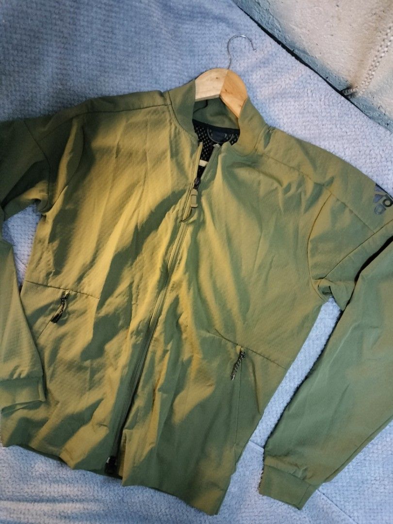 Adidas zne track jacket in green (Category: Coats, Jackets and Outerwear) located in Manila. Submitted by cyn.declutters (Listing ID 1458145598, Image 1). Description: full zip clousure , 2 side pockets adidas logo on sleeves 20" 25 in good condition loc Cainta.