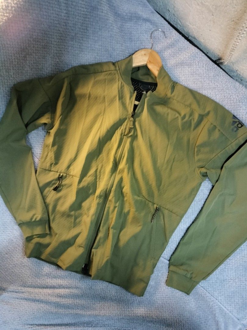 Adidas zne track jacket in green (Category: Coats, Jackets and Outerwear) located in Manila. Submitted by cyn.declutters (Listing ID 1458145598, Image 2). Description: full zip clousure , 2 side pockets adidas logo on sleeves 20" 25 in good condition loc Cainta.