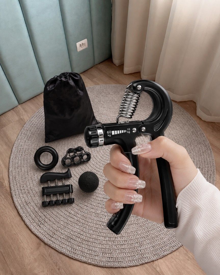 Adjustable Hand Gripper Set with Accessories (Category: Hands & Nails) located in Manila. Submitted by 2lj_closet (Listing ID 1458169676, Image 1). Description: - Complete 5-piece hand and forearm strength building set. - Adjustable hand gripper: 10kg to 60kg resistance. - Includes: Finger exerciser, grip ring, stress ball, finger stretcher. - All items are black. - Comes with a convenient black drawstring bag for storage and portability..