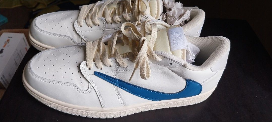 Air Jordan 1 Low SE Travis Scott (Category: Sneakers) located in Cainta. Submitted by detheos7 (Listing ID 1458119044, Image 2). Description: -Negotiable Price -no box - Air Jordan 1 Low SE Travis Scott - Colorway: Sail with a striking Blue Swoosh - Size: US 11 / EUR 45 - Includes original laces - Ideal for casual wear and everyday comfort.