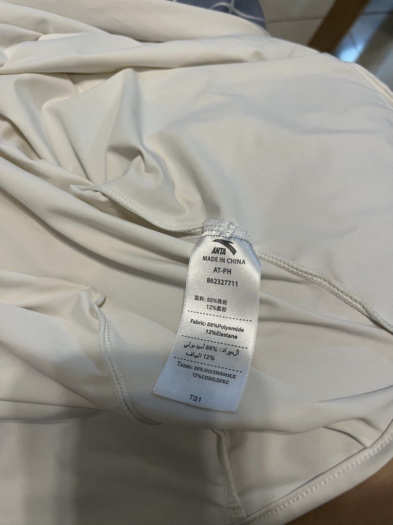 ANTA Lightweight Hoodie Jacket Size M (Category: Coats, Jackets and Outerwear) located in Mandaluyong City. Submitted by _cfpl (Listing ID 1458194392, Image 3). Description: - Lightweight ANTA hoodie jacket - Color: Cream - Size: Medium (M) - Material: 88% Polyamide, 12% Elastane - Features thumbholes on sleeves - Full front zipper - Small logo detail on chest - Ideal for outdoor activities and casual wear.