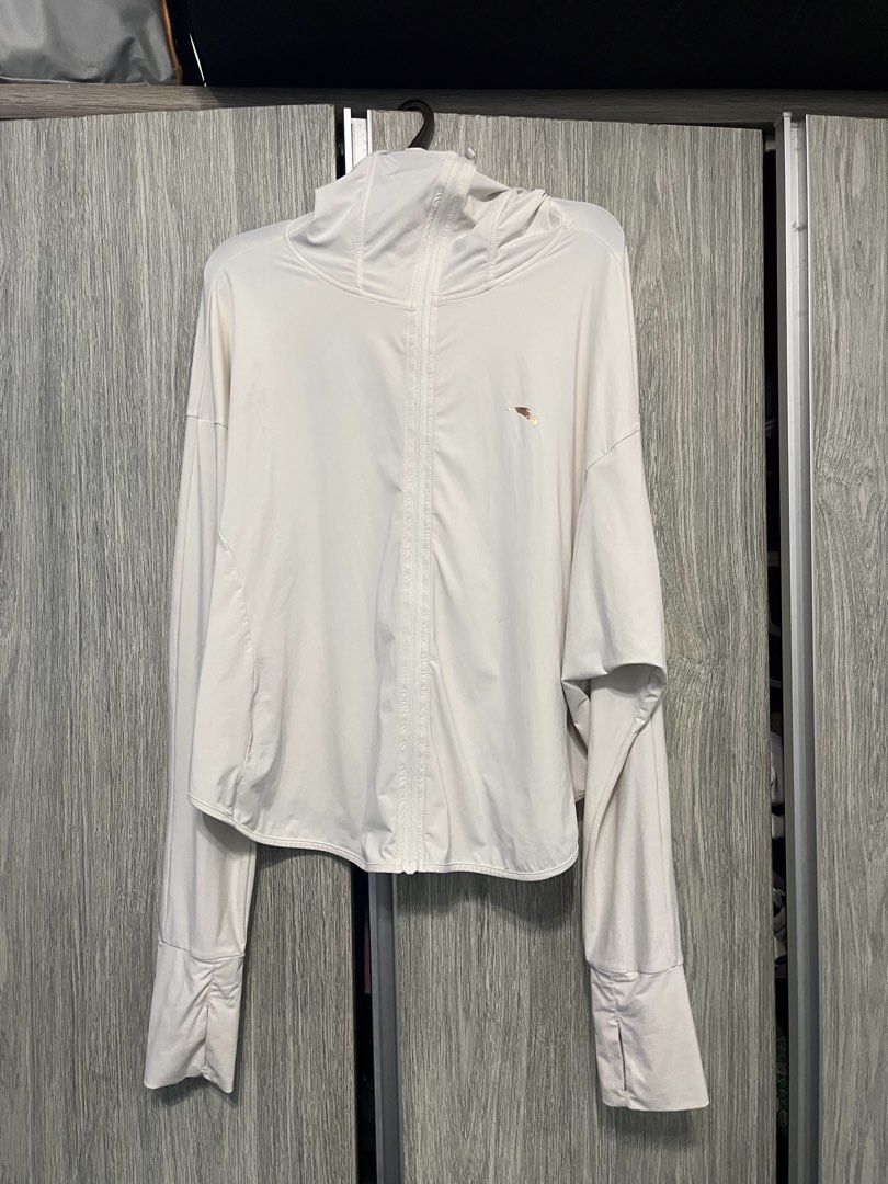 ANTA Lightweight Hoodie Jacket Size M (Category: Coats, Jackets and Outerwear) located in Mandaluyong City. Submitted by _cfpl (Listing ID 1458194392, Image 1). Description: - Lightweight ANTA hoodie jacket - Color: Cream - Size: Medium (M) - Material: 88% Polyamide, 12% Elastane - Features thumbholes on sleeves - Full front zipper - Small logo detail on chest - Ideal for outdoor activities and casual wear.