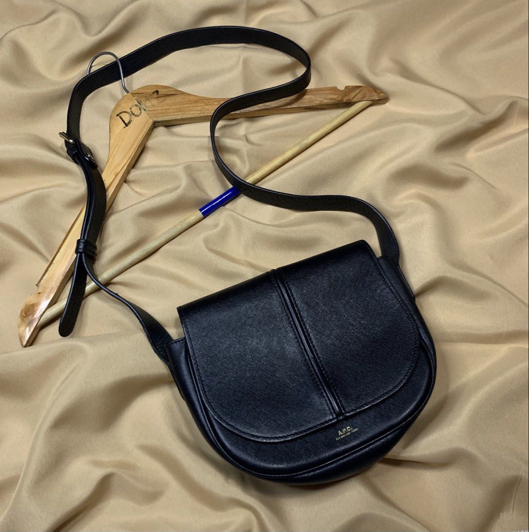 A.P.C. Black Leather Crossbody Bag (Category: Cross-body Bags) located in Polomolok. Submitted by domingthriftclothes (Listing ID 1458148696, Image 3). Description: - Authentic A.P.C. black leather crossbody bag - Classic saddle shape with secure flap closure - Adjustable strap for comfortable, customizable wear - Elegant gold-tone hardware accents - Minimalist and versatile design, ideal for daily use.