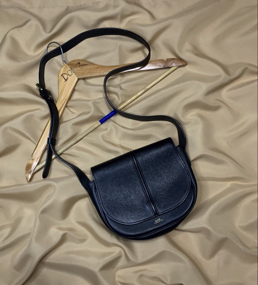 A.P.C. Black Leather Crossbody Bag (Category: Cross-body Bags) located in Polomolok. Submitted by domingthriftclothes (Listing ID 1458148696, Image 2). Description: - Authentic A.P.C. black leather crossbody bag - Classic saddle shape with secure flap closure - Adjustable strap for comfortable, customizable wear - Elegant gold-tone hardware accents - Minimalist and versatile design, ideal for daily use.