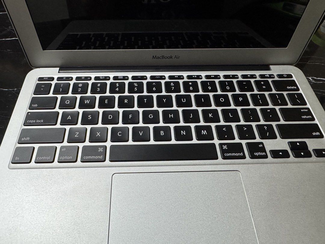 Apple MacBook Air Laptop (Category: Laptops & Notebooks) located in Makati City. Submitted by hotstuff00 (Listing ID 1458217175, Image 2). Description: - Reliable MacBook Air for everyday tasks - Clean and functional keyboard - Minor exterior wear, consistent with normal use - Ideal for students or portable computing needs - Charger included.