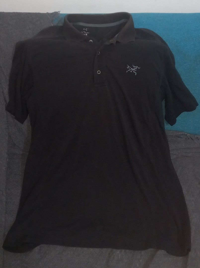 Arc'teryx Polo Shirt - Black - Size M (Category: Tshirts & Polo Shirts ) located in Cagayan de Oro. Submitted by edwardryan01984 (Listing ID 1458113682, Image 1). Description: - Brand: Arc'teryx - Color: Black - Style: Short-sleeve polo shirt with collar and button-up front - Material: Cotton and spandex blend (for comfort and stretch) - Features: Iconic embroidered Arc'teryx logo on chest - Ideal for: Casual wear, light outdoor activities - Care