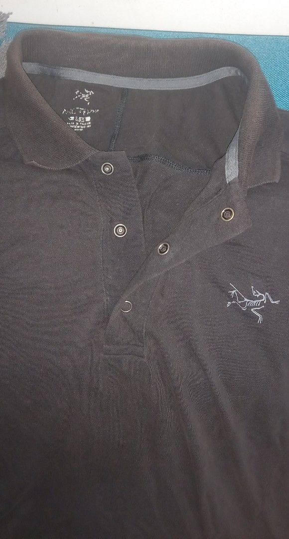 Arc'teryx Polo Shirt - Black - Size M (Category: Tshirts & Polo Shirts ) located in Cagayan de Oro. Submitted by edwardryan01984 (Listing ID 1458113682, Image 2). Description: - Brand: Arc'teryx - Color: Black - Style: Short-sleeve polo shirt with collar and button-up front - Material: Cotton and spandex blend (for comfort and stretch) - Features: Iconic embroidered Arc'teryx logo on chest - Ideal for: Casual wear, light outdoor activities - Care