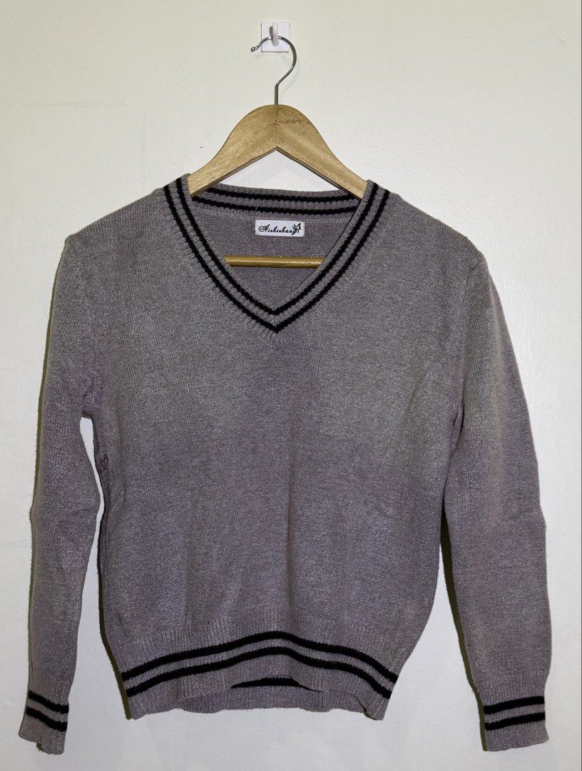 Ashishaa Grey V-Neck Sweater with Black Stripes (Category: Longsleeves) located in Cavite. Submitted by maxs.bl (Listing ID 1458140005, Image 1). Description: - Grey v-neck sweater - Black stripes on collar and hem - Long sleeves - Classic school uniform aesthetic - Versatile for layering or standalone wear - with stains but i think deep cleaning might help.