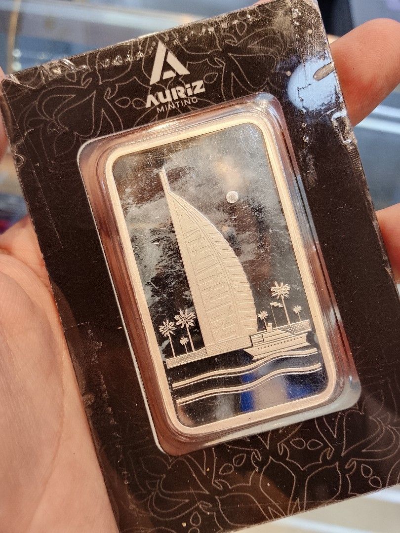 Auriz Minting 100g Fine Silver Bar 999 (Category: Currency) located in Manila. Submitted by trumpisthedevil (Listing ID 1458098752, Image 2). Description: - 100 gram Fine Silver Bar - Auriz Minting - Purity: 999 - Reverse design: Dhow ship with palm trees - Comes sealed in original packaging - Serial Number: AB00859 - Ideal for collectors or investment.