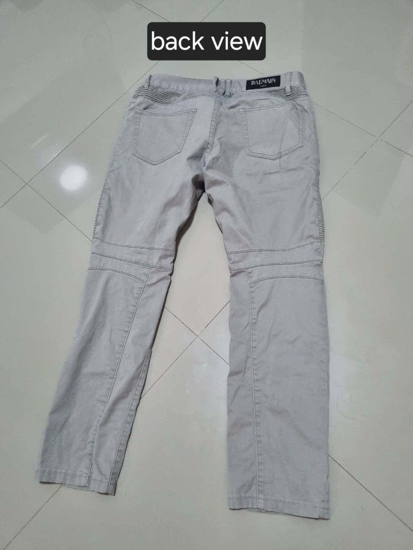 Authentic Balmain Paris Grey Moto Biker Pants (Category: Jeans) located in Pasig City. Submitted by jenahhanej (Listing ID 1458117408, Image 2). Description: AUTHENTIC BALMAIN PARIS BIKER PANTS Size: 32 Color: Light Grey Material: 100% Cotton - Made in Italy Fit: Slim biker cut with signature ruched thighs + zip pockets Condition: 8.5/10 - Worn but well maintained - Minor fray on back pocket only - see on pic - No stains, no tears, color is even 