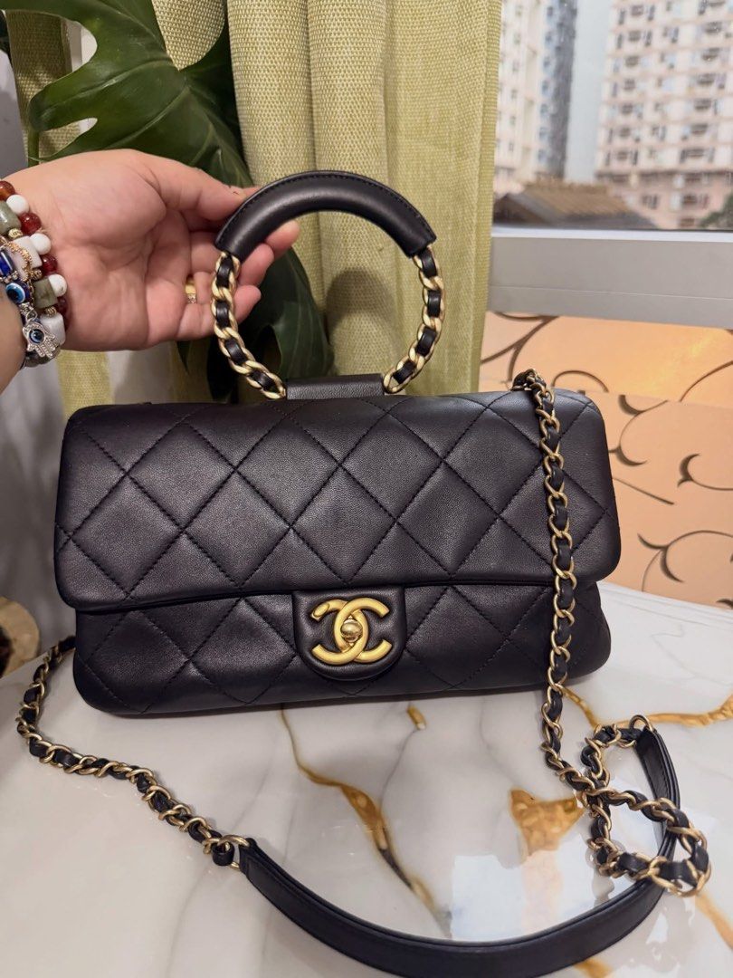 Authentic Chanel (Category: Luxury Bags & Wallets) located in Manila. Submitted by chloe_luxuries (Listing ID 1458120658, Image 1). Description: Guaranteed Original Chanel Cruise 2020 Circular Handle Flap small in black Series 29 Comes with dustbag Pm for more details .