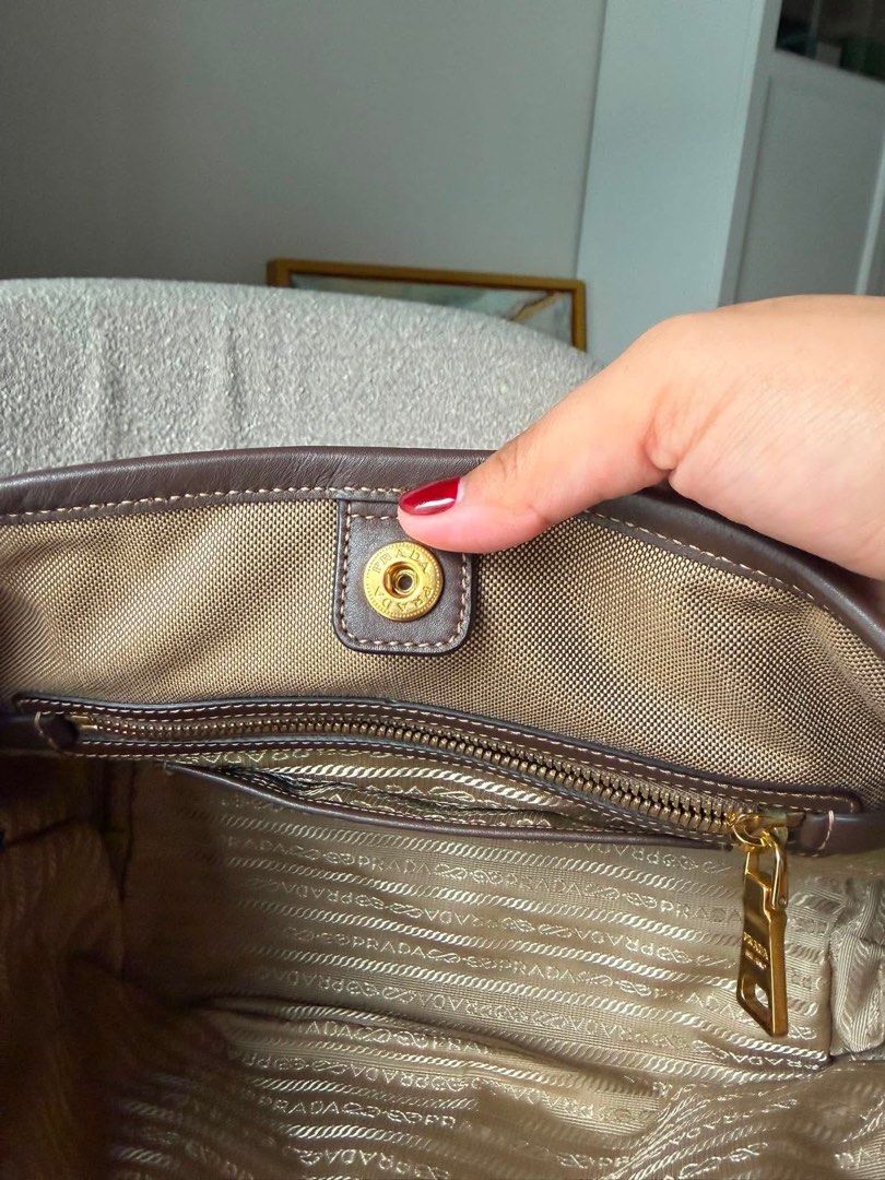 Authentic Prada Logo Jacquard Bow Tote (Category: Luxury Bags & Wallets) located in Quezon City. Submitted by jhaediah (Listing ID 1448706591, Image 3). Description: Authentic No foul smell Preloved with dustbag and leather strap.
