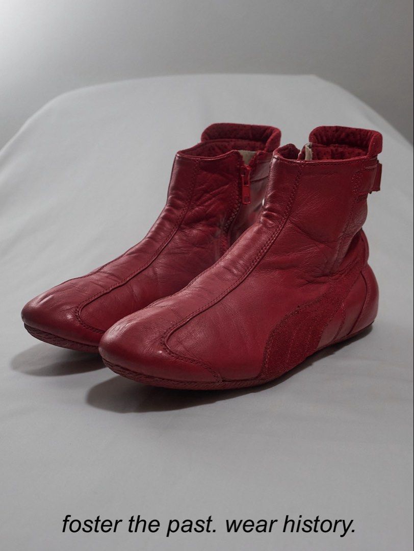 AW04 Puma—Red Leather Racing Boots (Category: Sneakers) located in Quezon City. Submitted by soourceph (Listing ID 1458115602, Image 1). Description: Before the speedcat phenom with pinterest baddies pulling off the same shein wide leg denims, Puma has been building its Motorsport legacy since the 90s This early 2000s offering greatly references the 1998 release of the Puma Speedcat. The ankle cut is complemented with zipper and velcro closure fo