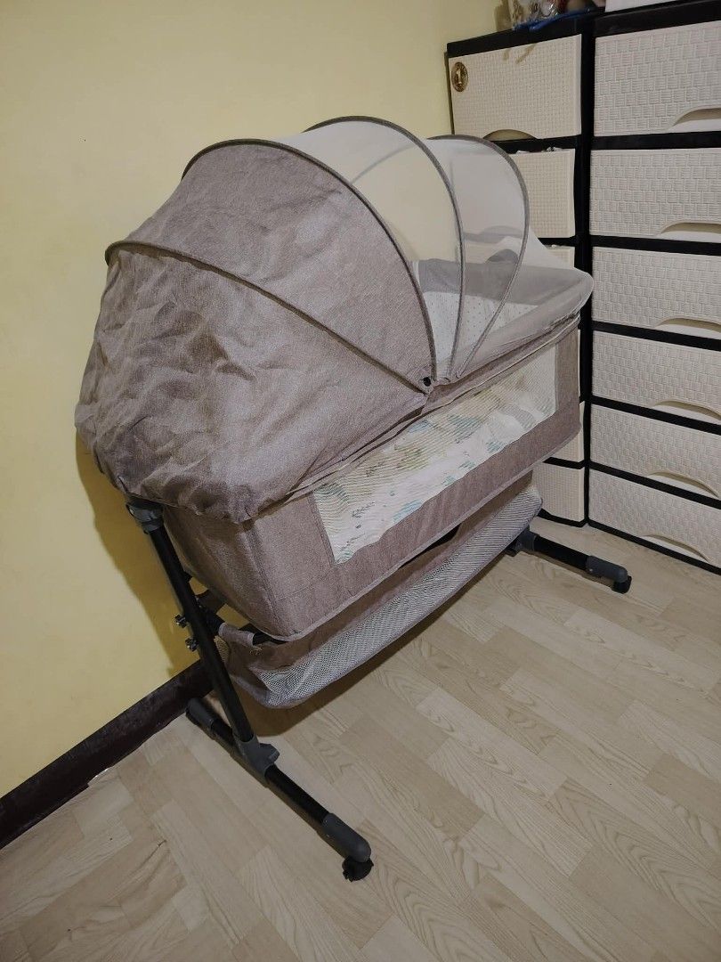 Baby Bassinet with Mosquito Net and Rocking Function (Category: Cots & Cribs) located in Valenzuela. Submitted by nica98 (Listing ID 1458115441, Image 3). Description: Portable baby bassinet with rocking, mosquito net, and storage. Mesh sides for ventilation. Easy to assemble and move. Keep baby close!.