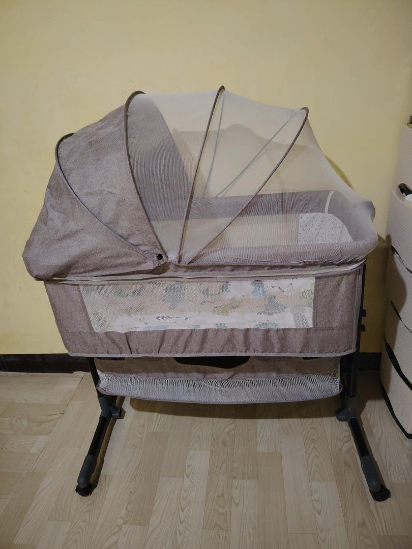 Baby Bassinet with Mosquito Net and Rocking Function (Category: Cots & Cribs) located in Valenzuela. Submitted by nica98 (Listing ID 1458115441, Image 2). Description: Portable baby bassinet with rocking, mosquito net, and storage. Mesh sides for ventilation. Easy to assemble and move. Keep baby close!.