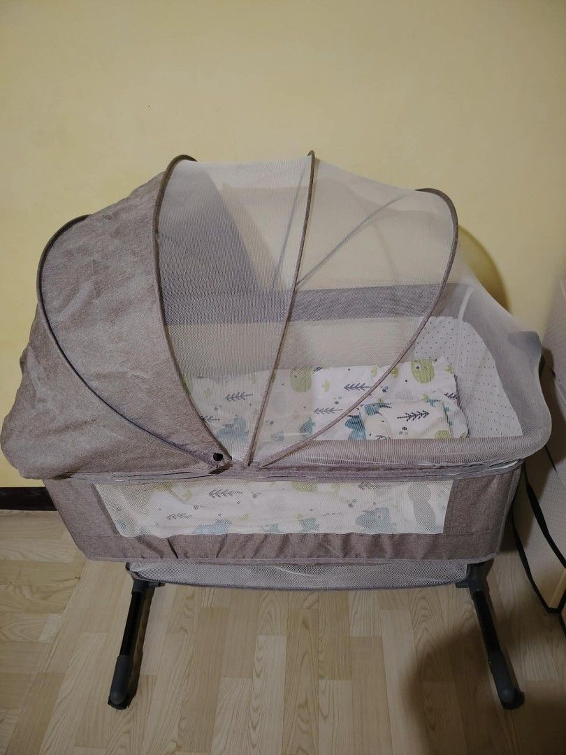 Baby Bassinet with Mosquito Net and Rocking Function (Category: Cots & Cribs) located in Valenzuela. Submitted by nica98 (Listing ID 1458115441, Image 1). Description: Portable baby bassinet with rocking, mosquito net, and storage. Mesh sides for ventilation. Easy to assemble and move. Keep baby close!.